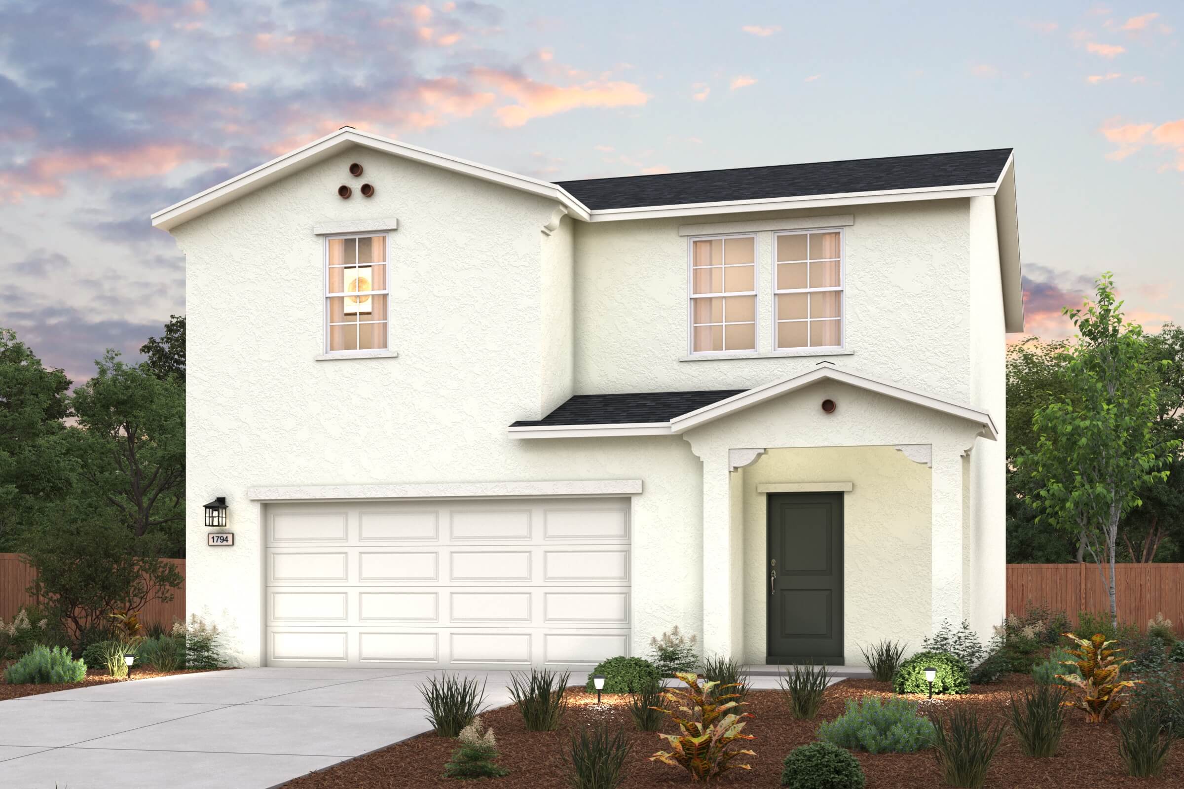 A white house with a garage.