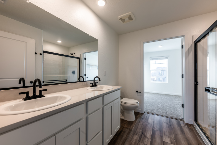 A bathroom with a sink and a toilet.