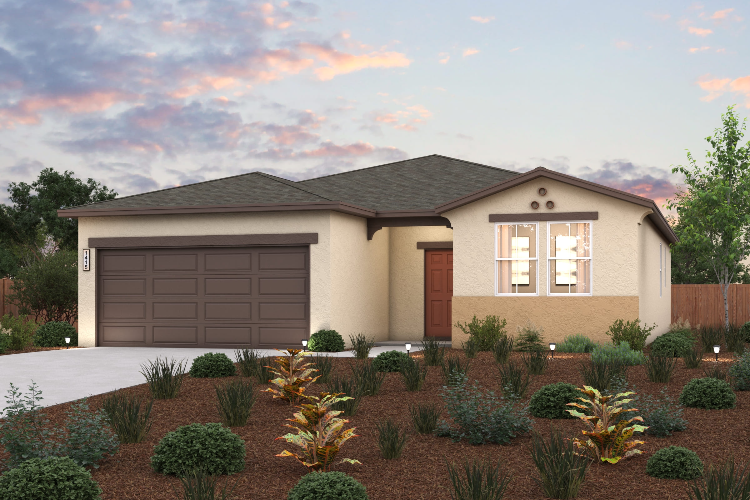 A house with a garage and bushes in front of it.