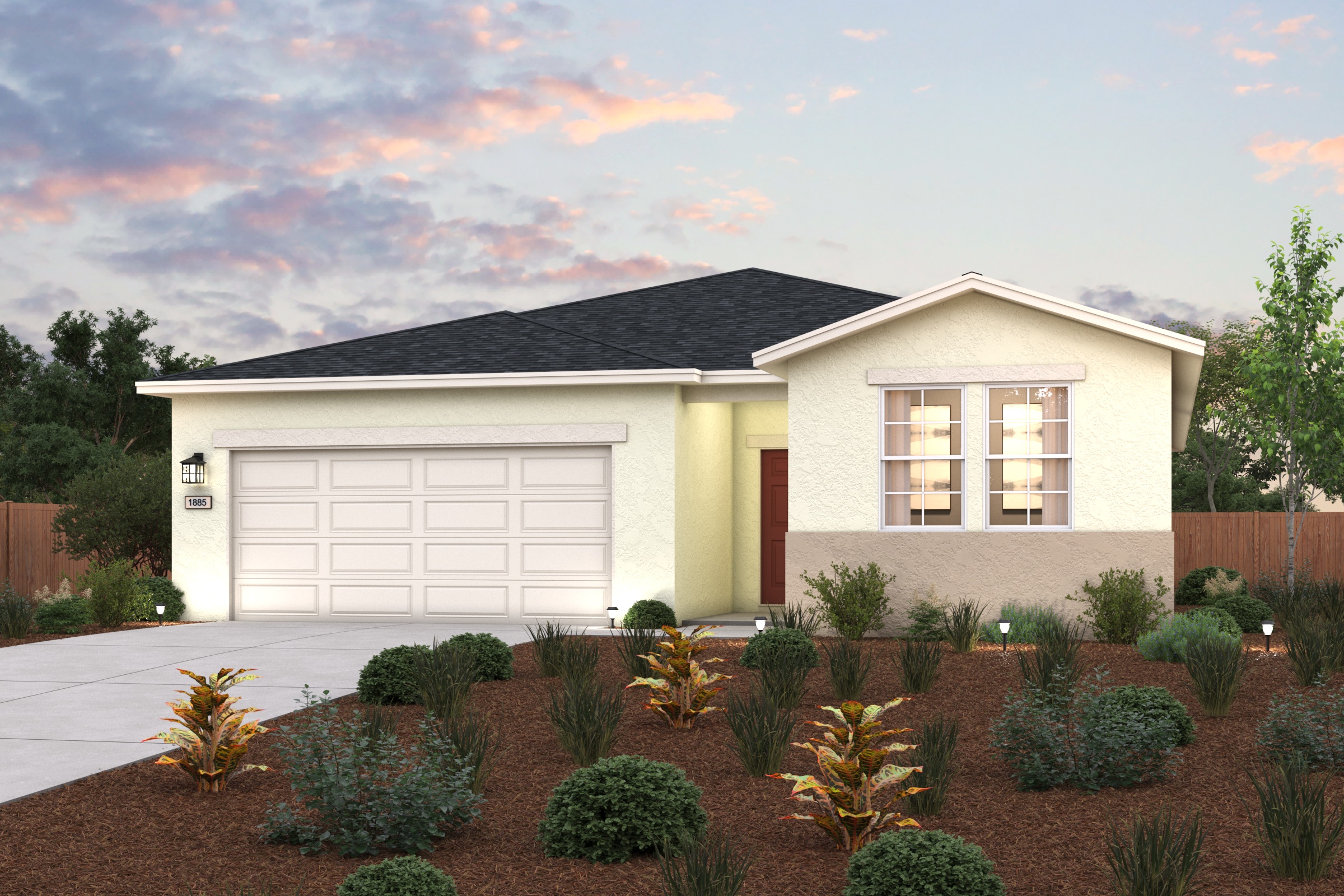 A house with a garage and bushes.