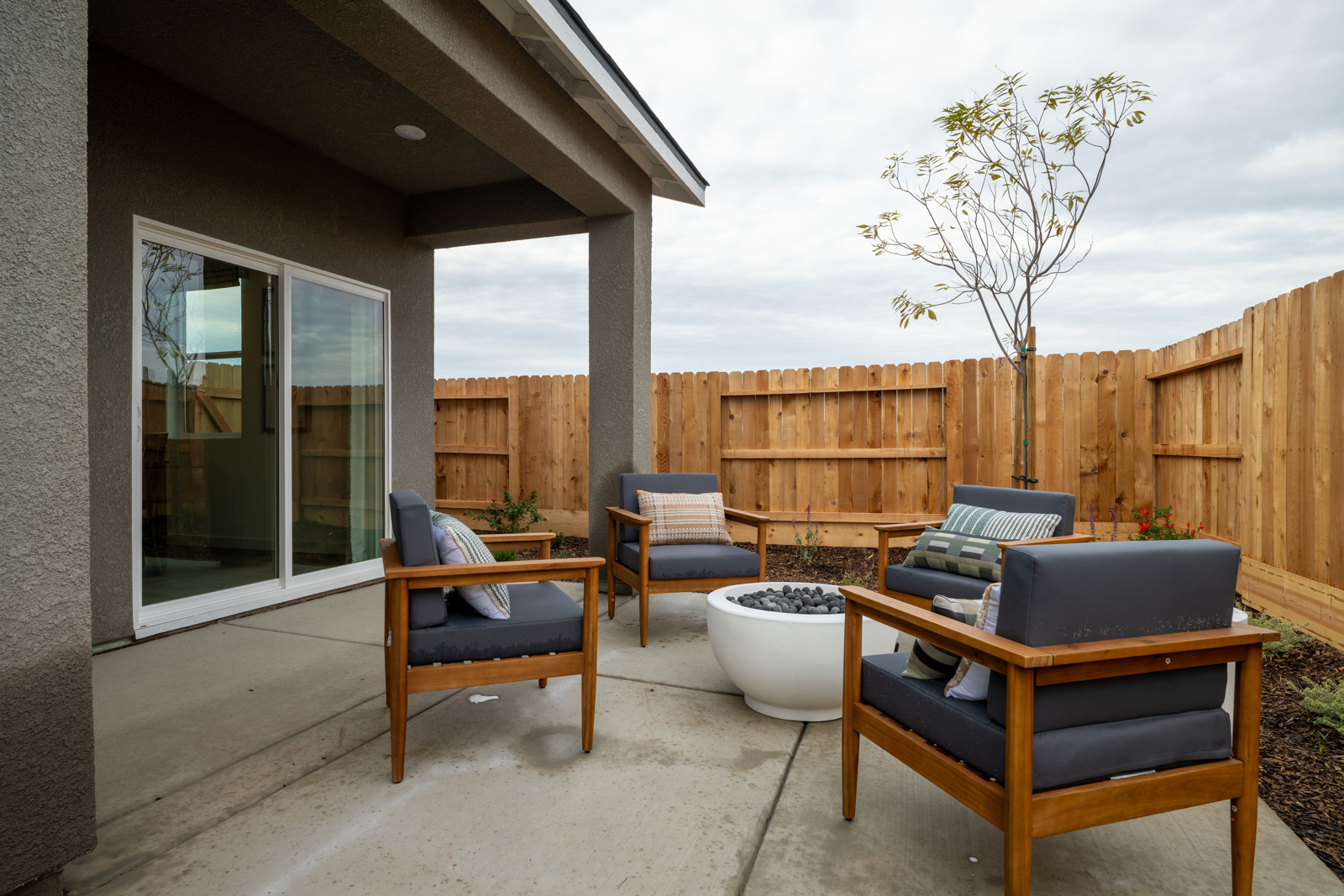 A deck with chairs and a table.