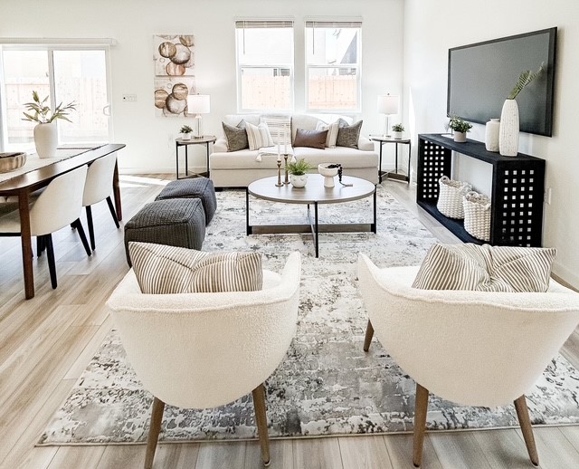 A living room with white furniture.