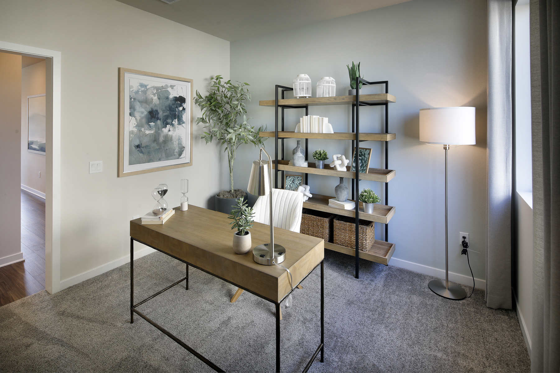 A room with a table and shelves.