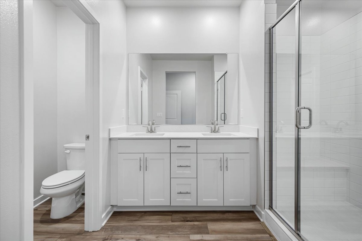 A bathroom with a glass shower.