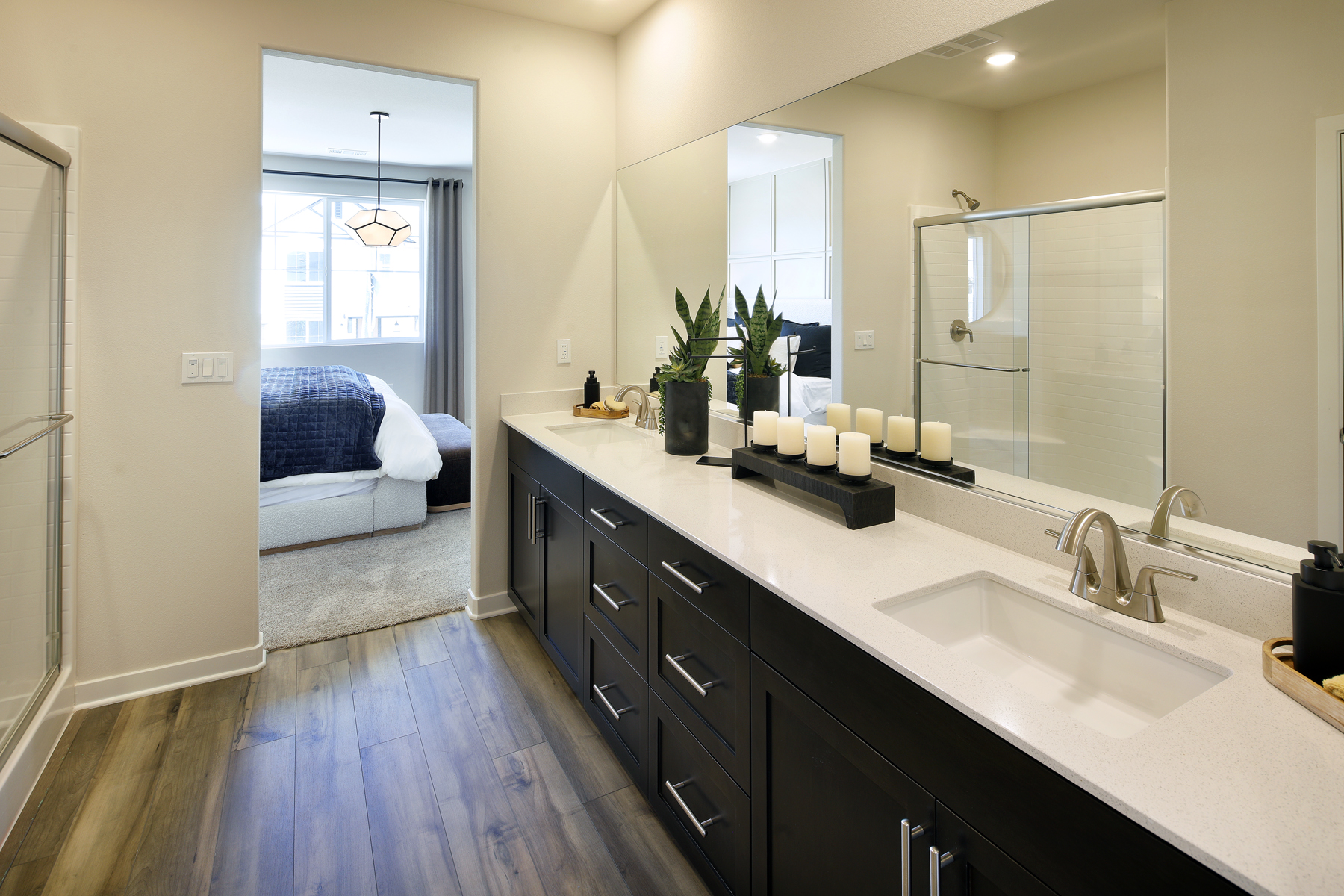 A bathroom with a large mirror.
