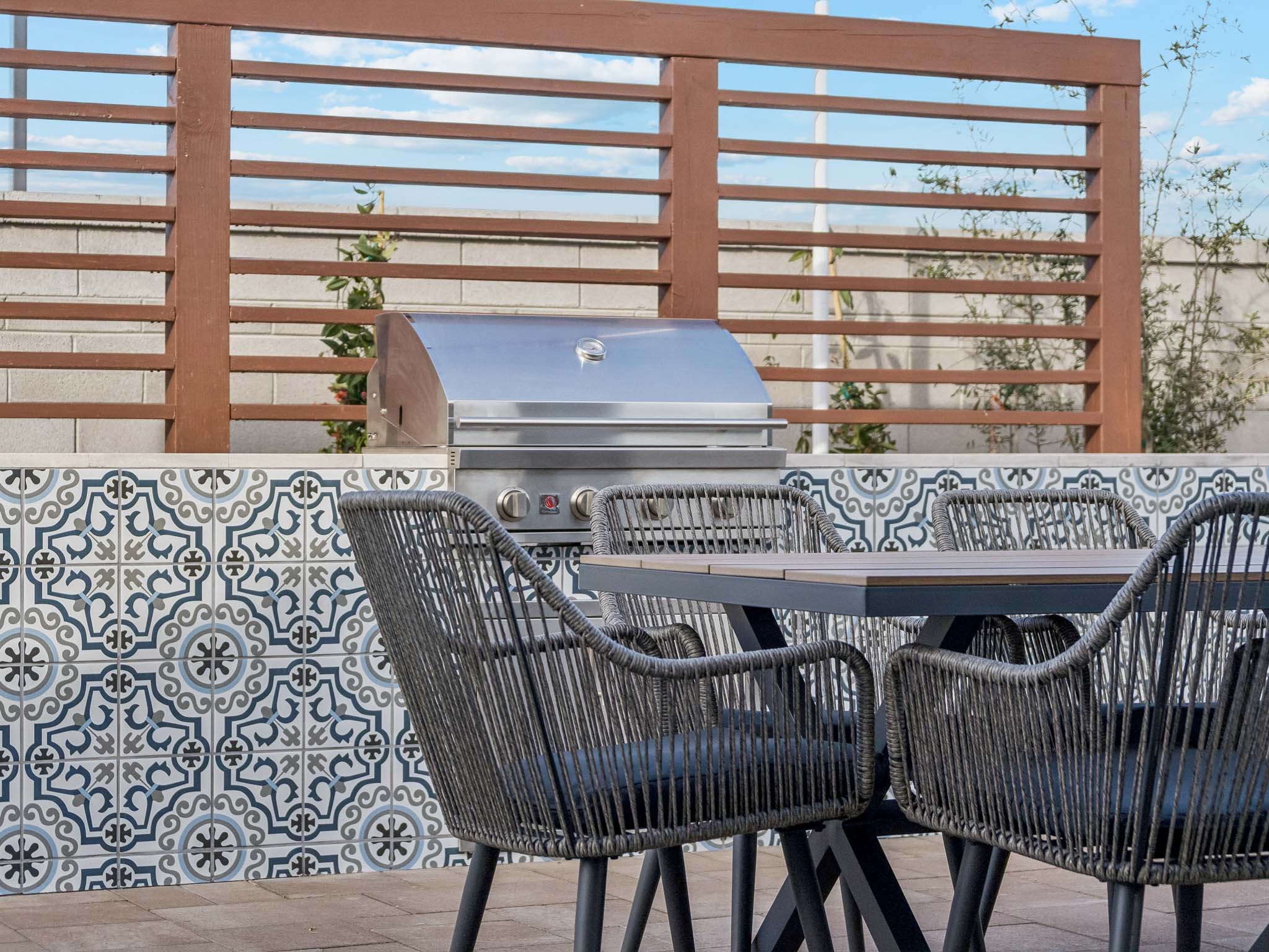 A grill on a deck.