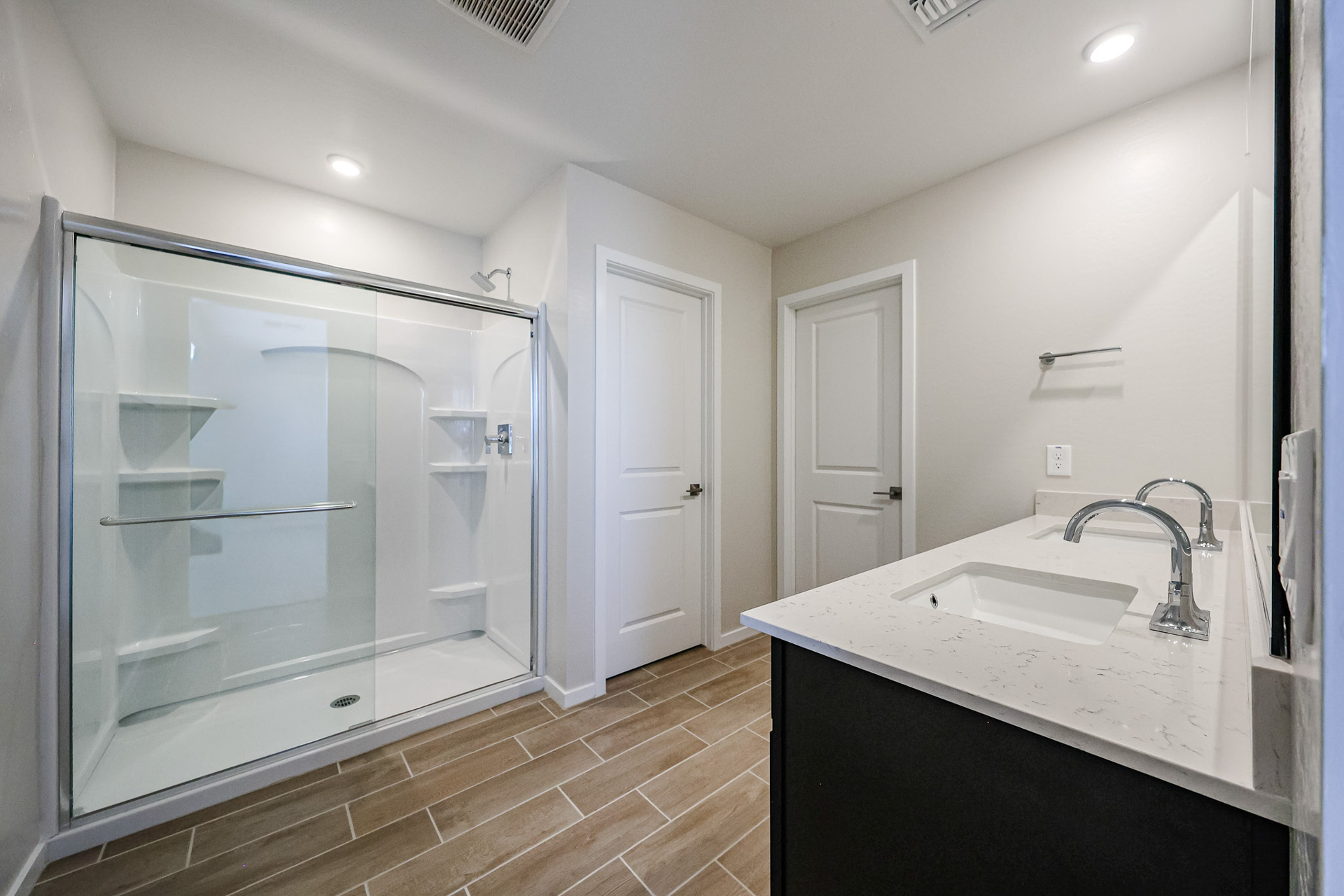 A bathroom with a glass shower.