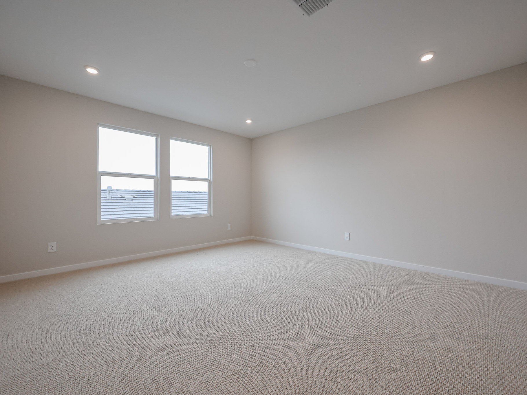 A room with a bed and a window.