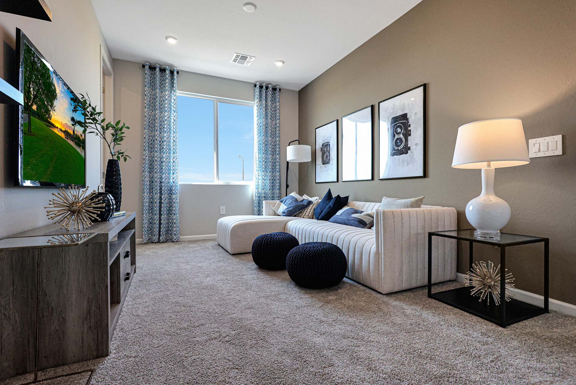 A living room with a large television.