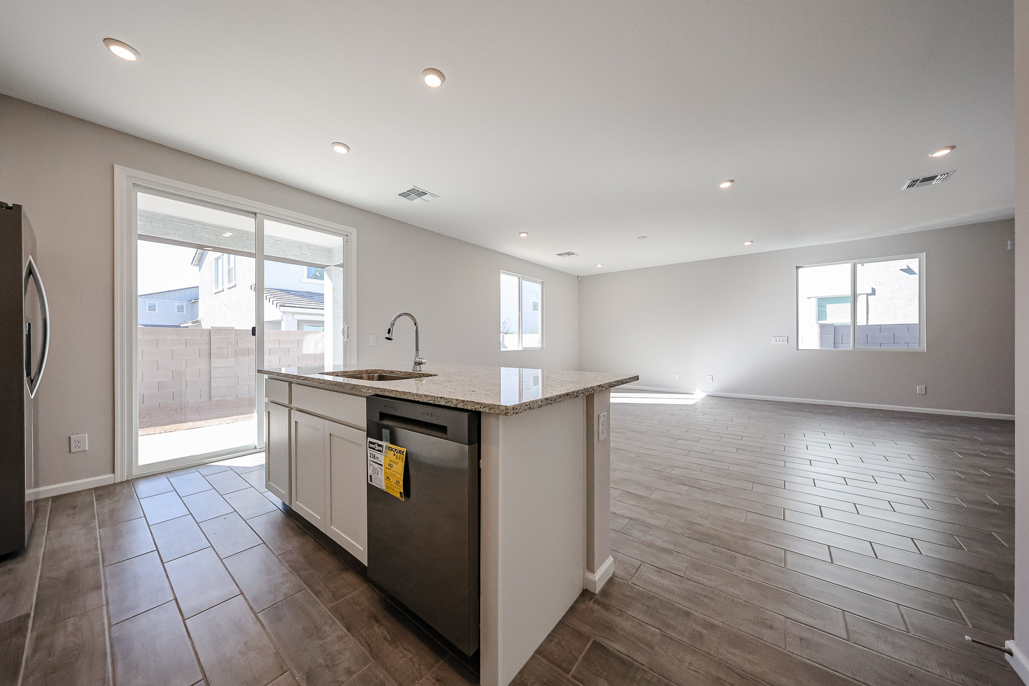 A kitchen with a large glass door.