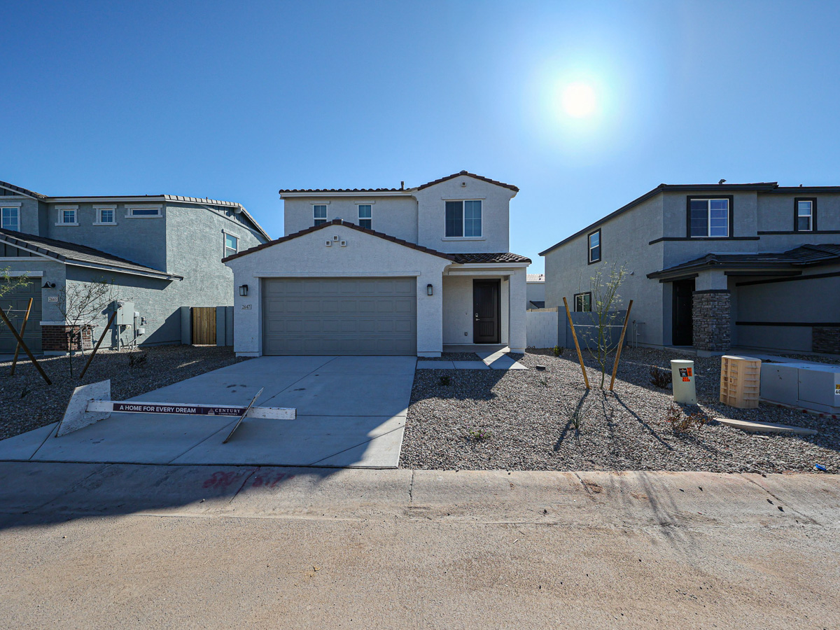 A group of houses with a blue sky.