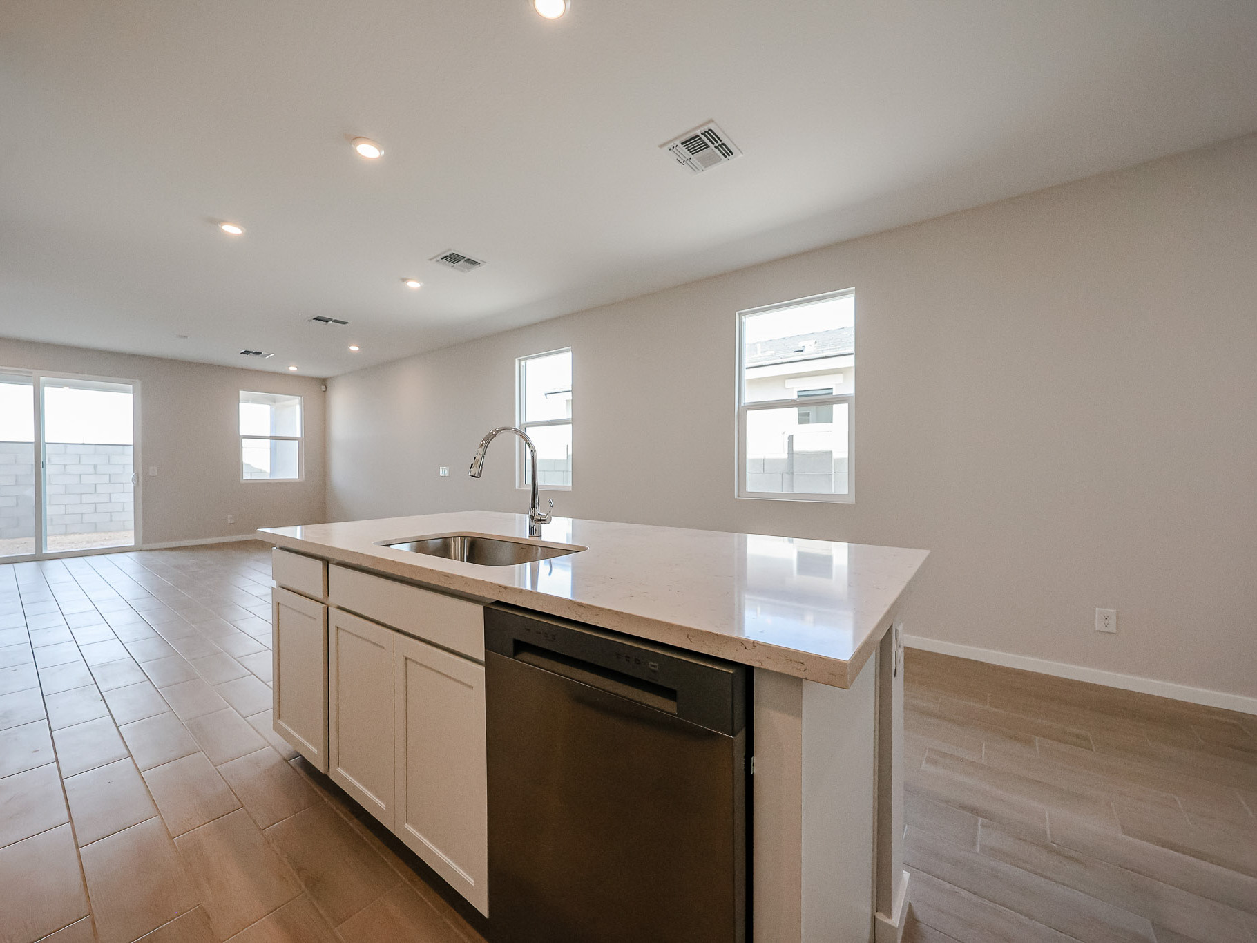 A kitchen with a sink and a counter top.