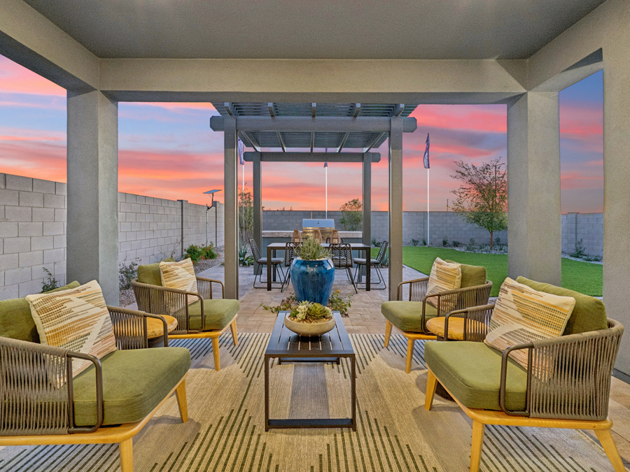 A patio with chairs and tables.