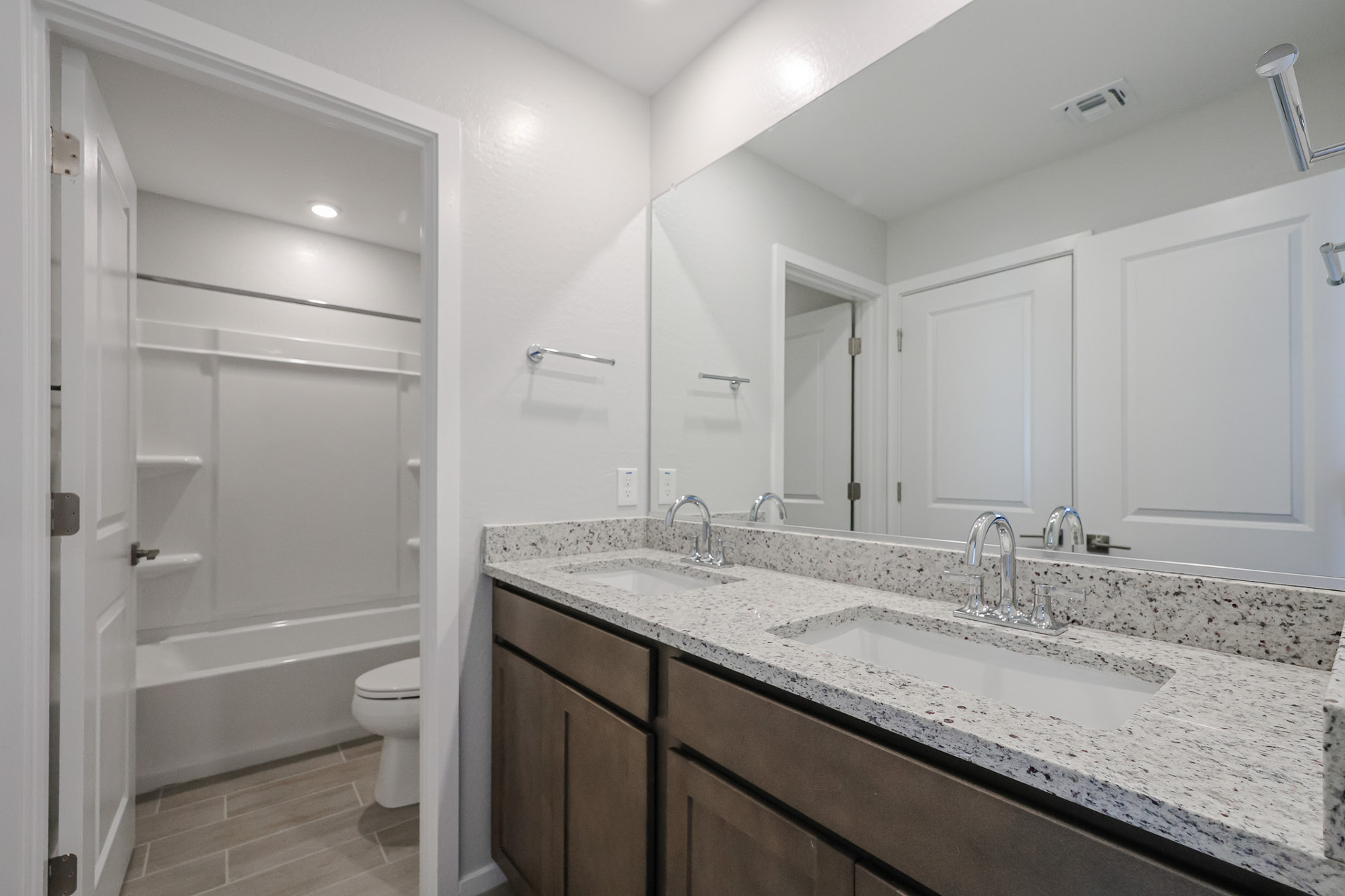 A bathroom with a marble countertop.