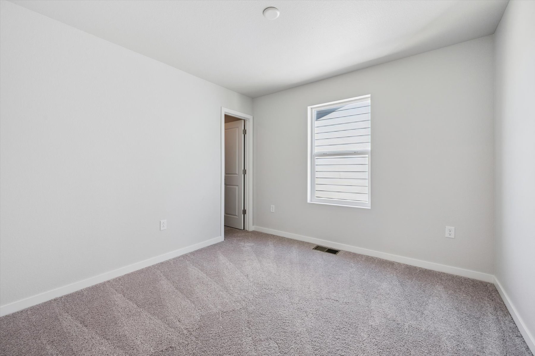 A room with a door and a window.