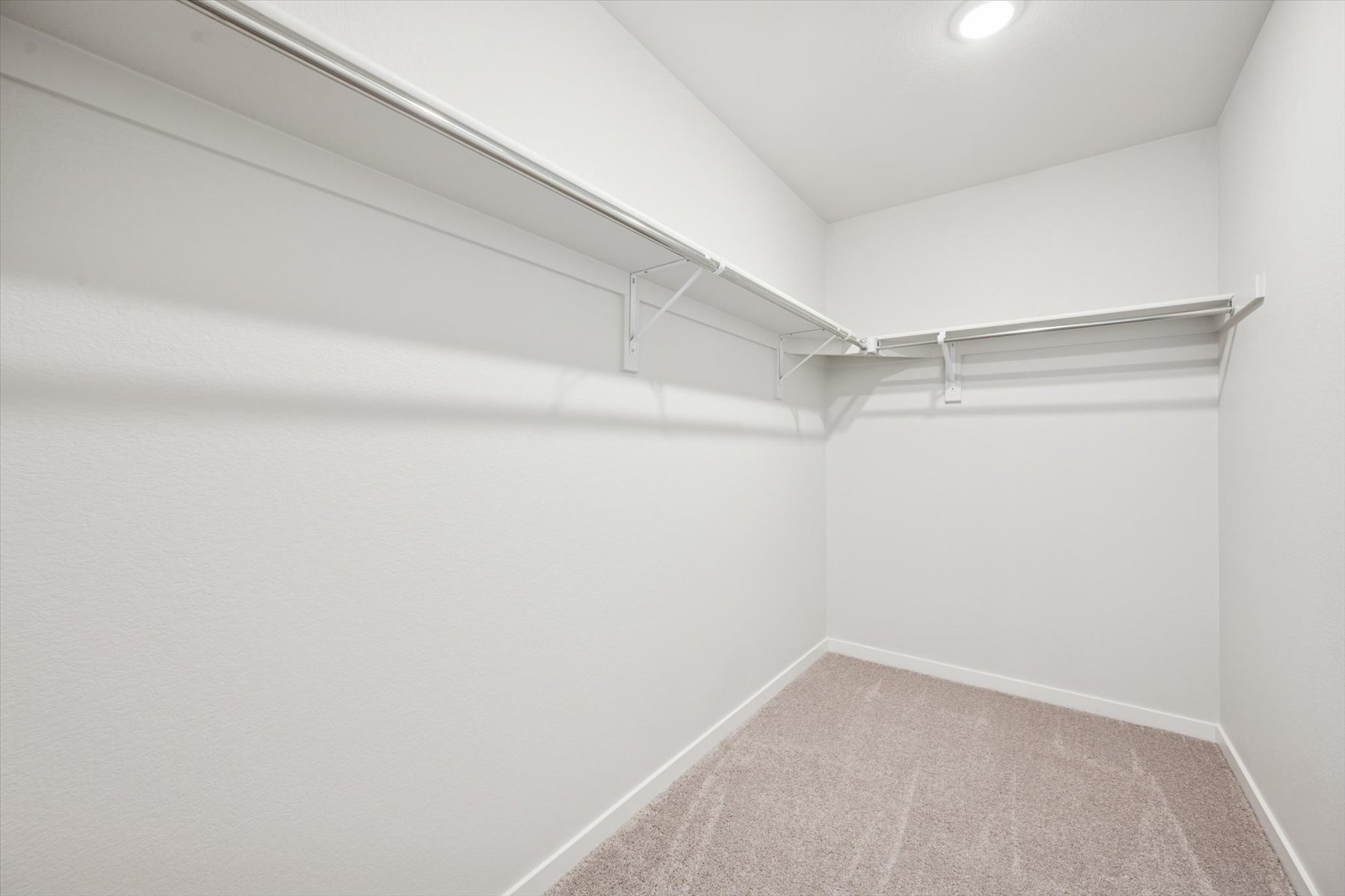 A white hallway with a light.