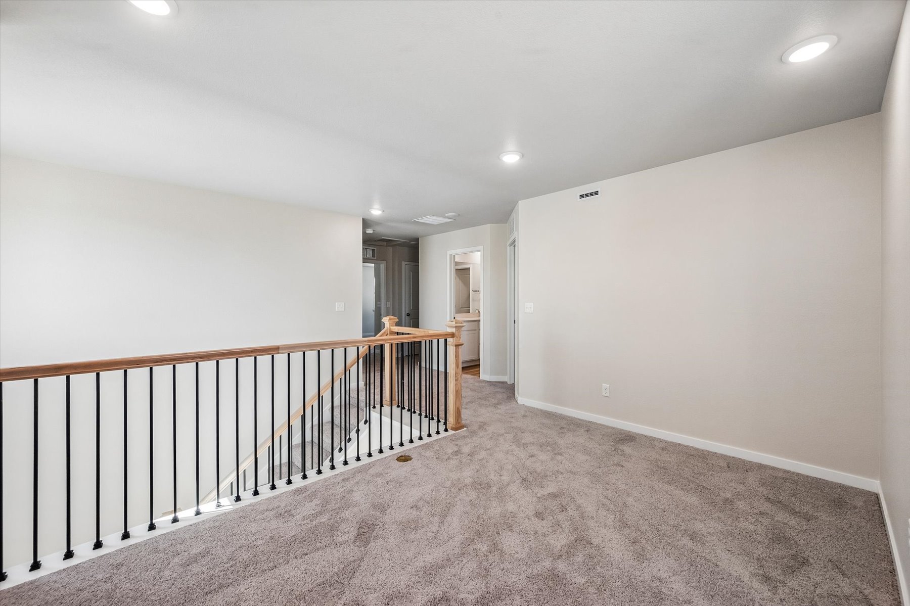 A hallway with white walls.