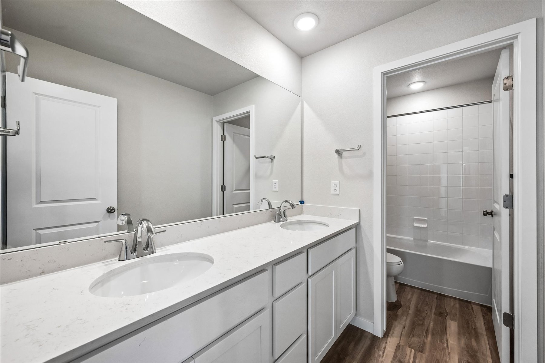 A bathroom with a sink and a shower.