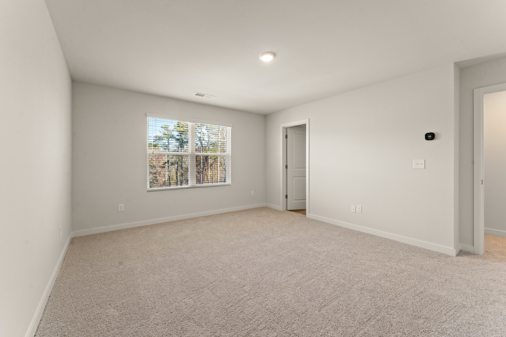 A room with a window and a door.