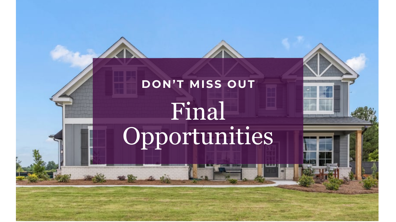 A large building with a sign in front of it.