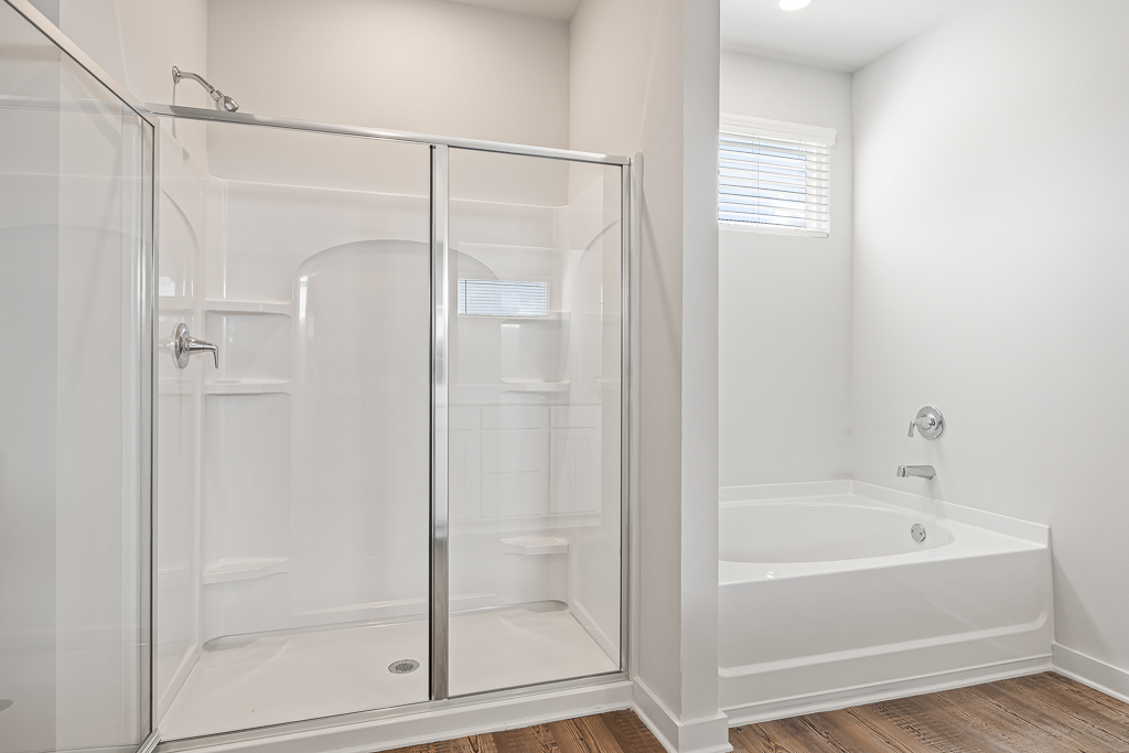 A bathroom with a glass shower.