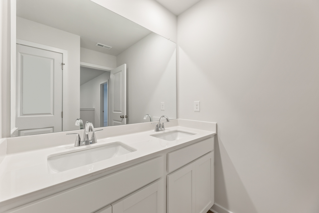 A bathroom with two sinks.