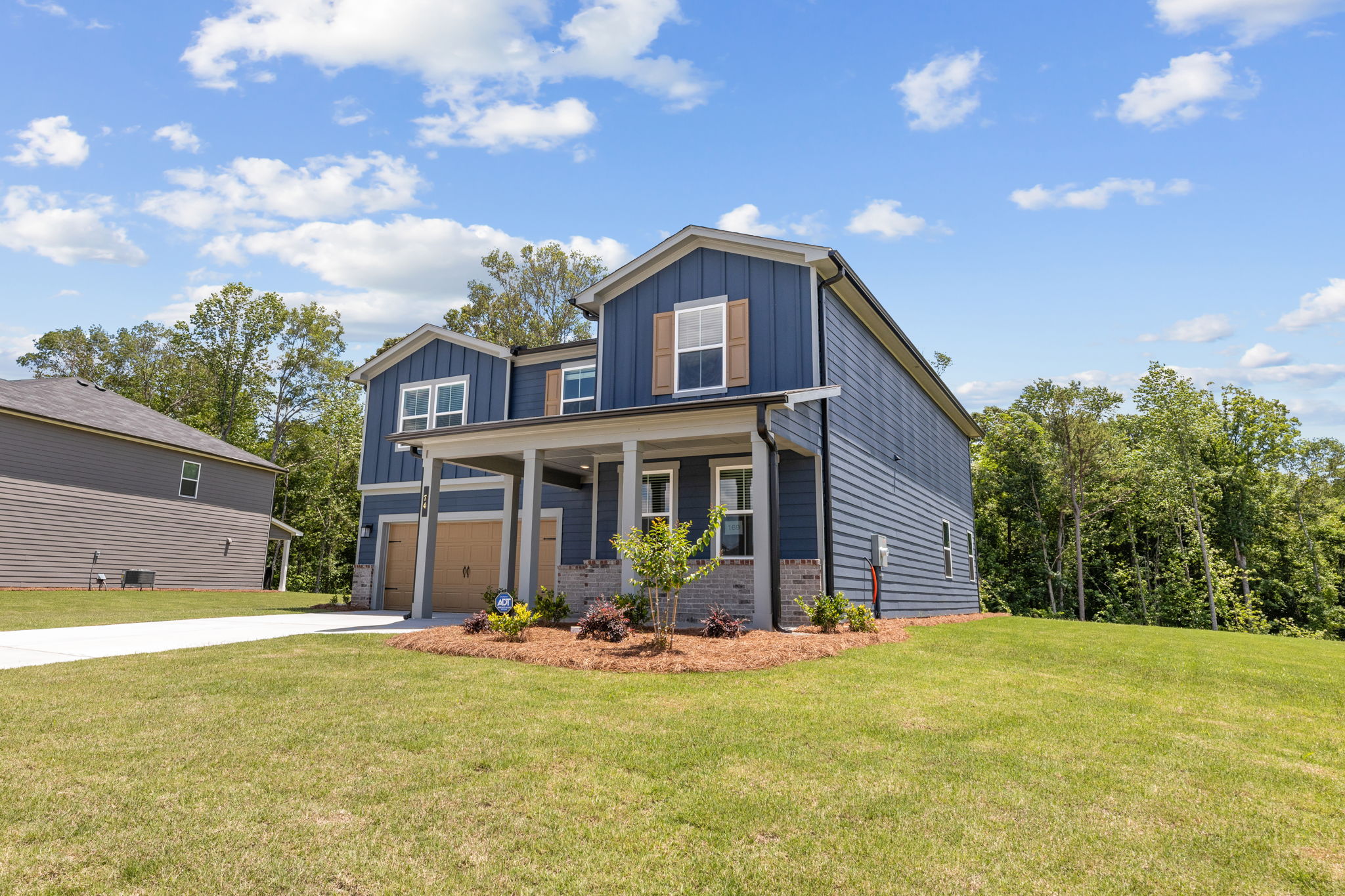A house with a lawn and trees.
