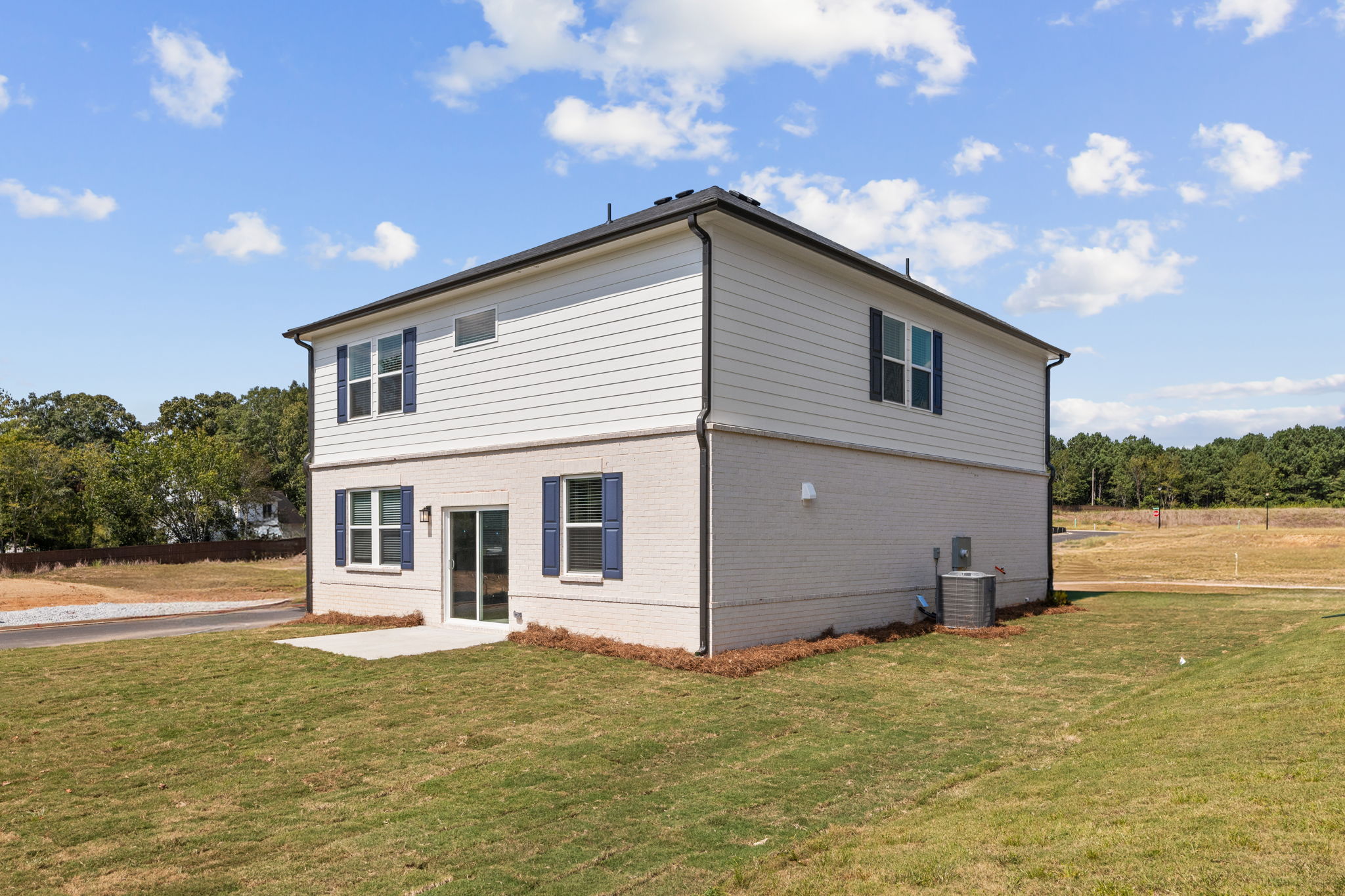 A house with a grass yard.