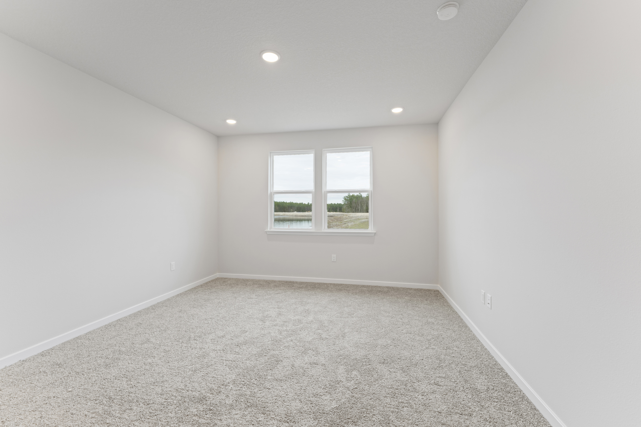 Lot 140 Primary Bedroom with Two Windows and Water View at The Preserve at Camden Woods