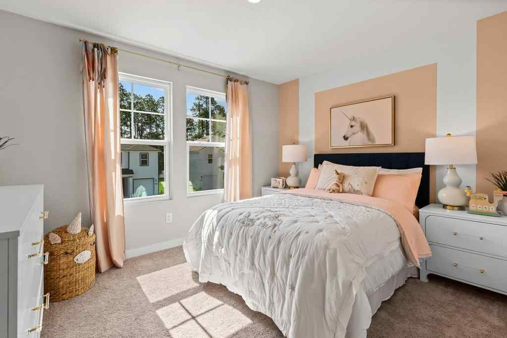 A bedroom with a bed and a window.