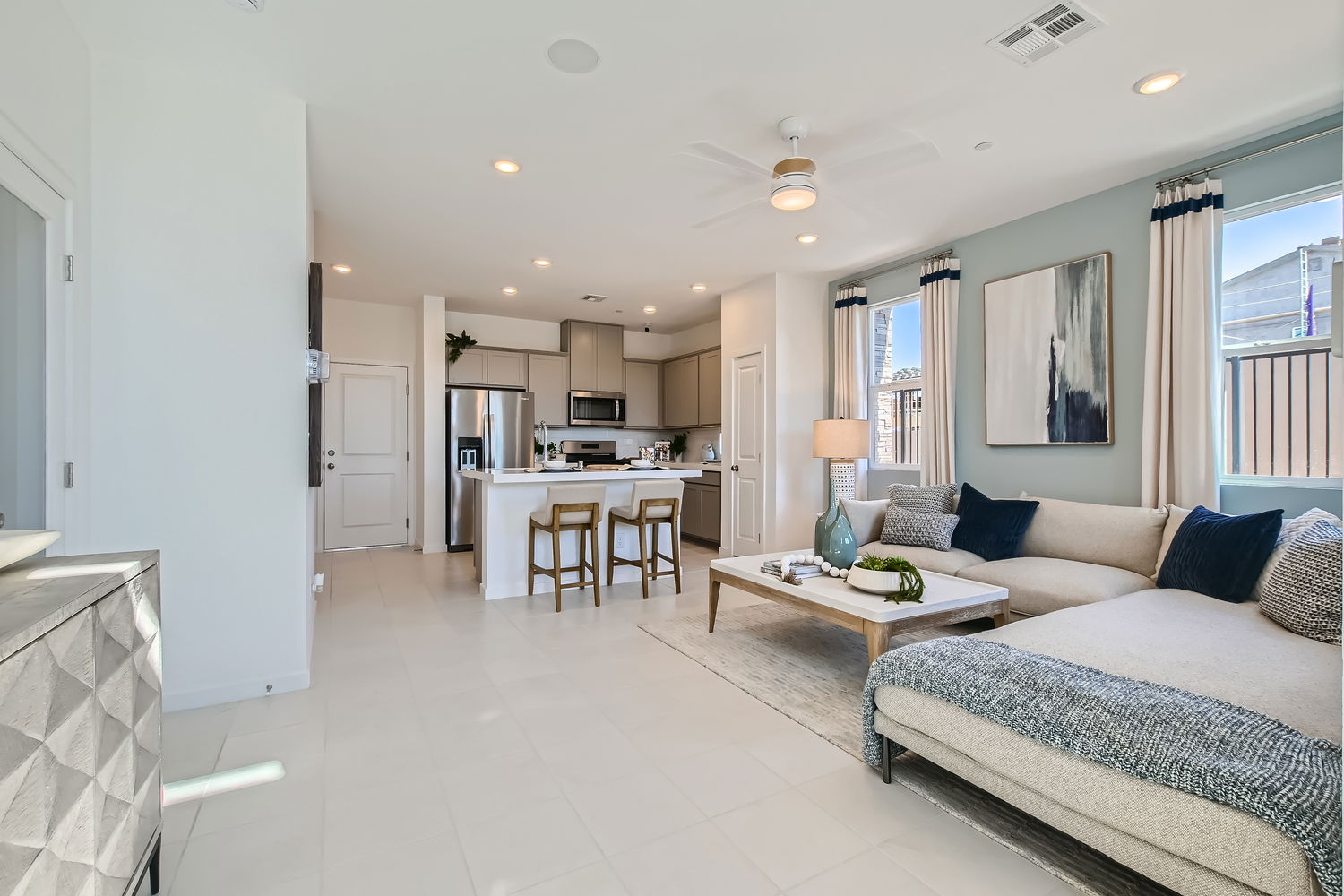 A large bedroom with a bed and a table.