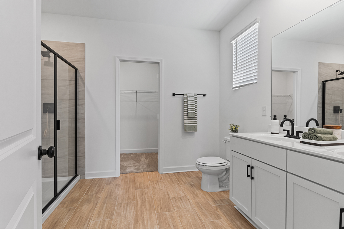 A bathroom with a toilet and sink.