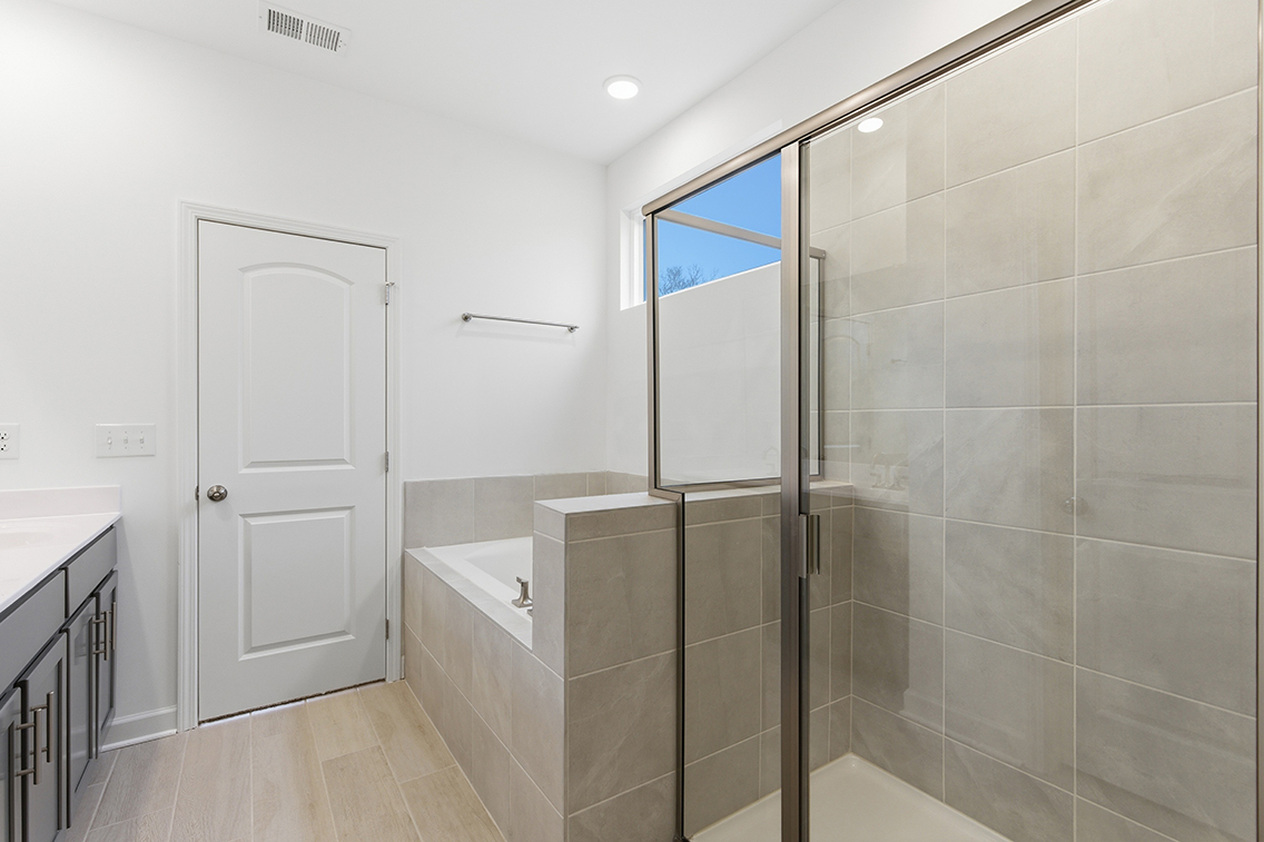 A bathroom with a glass shower.