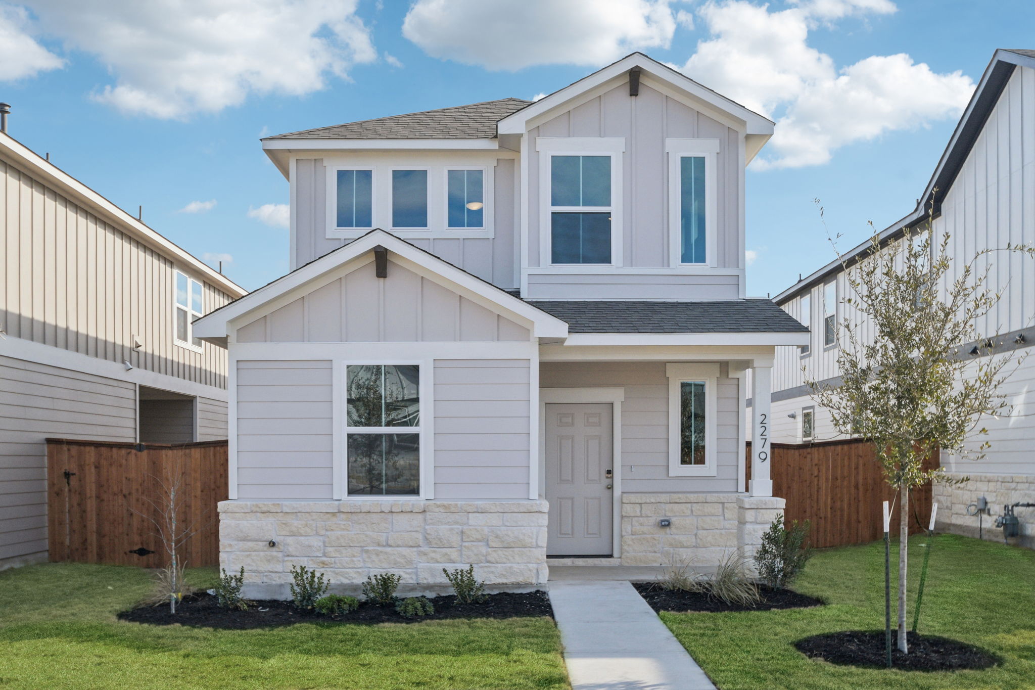 A white house with a driveway.