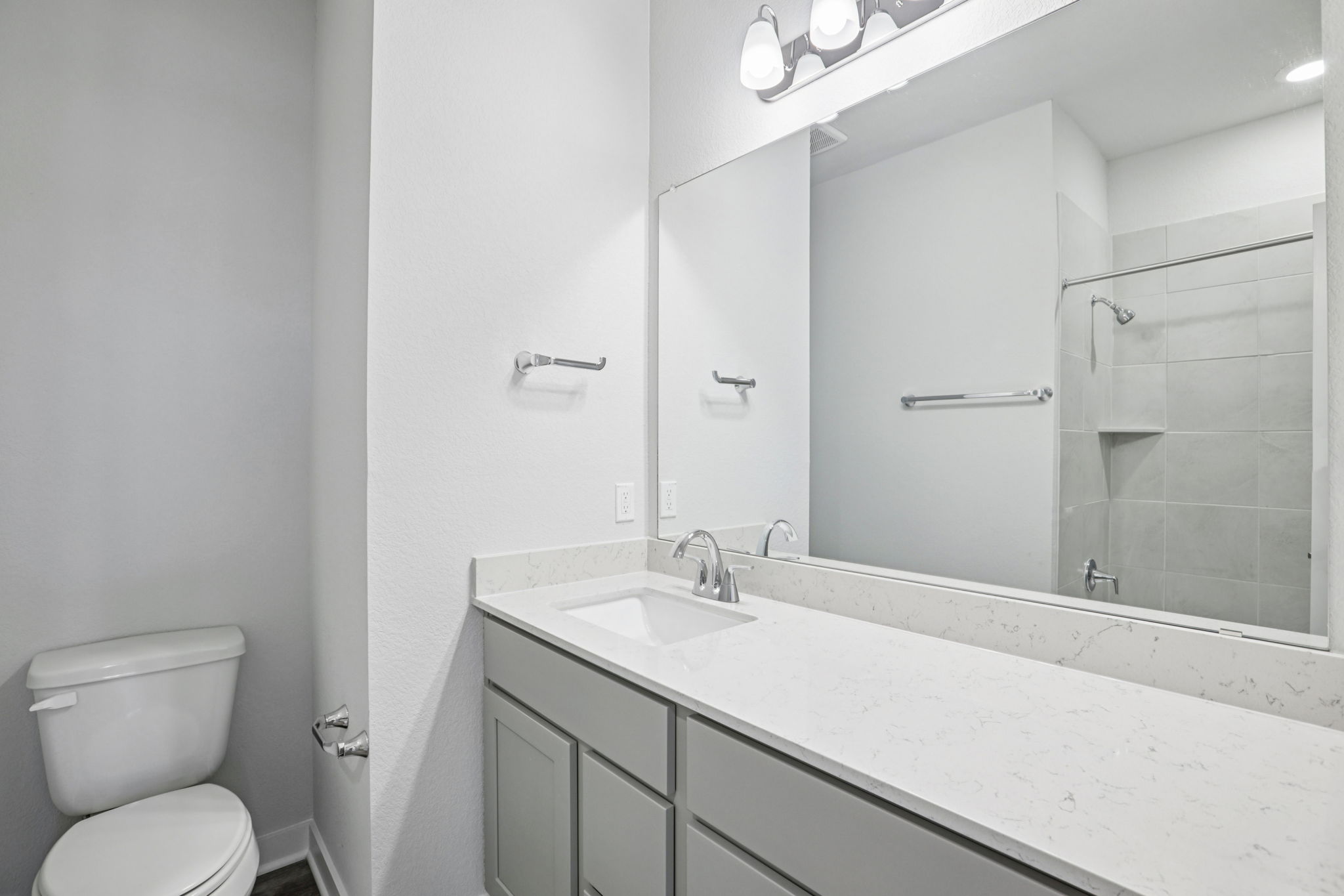 A bathroom with a glass shower.