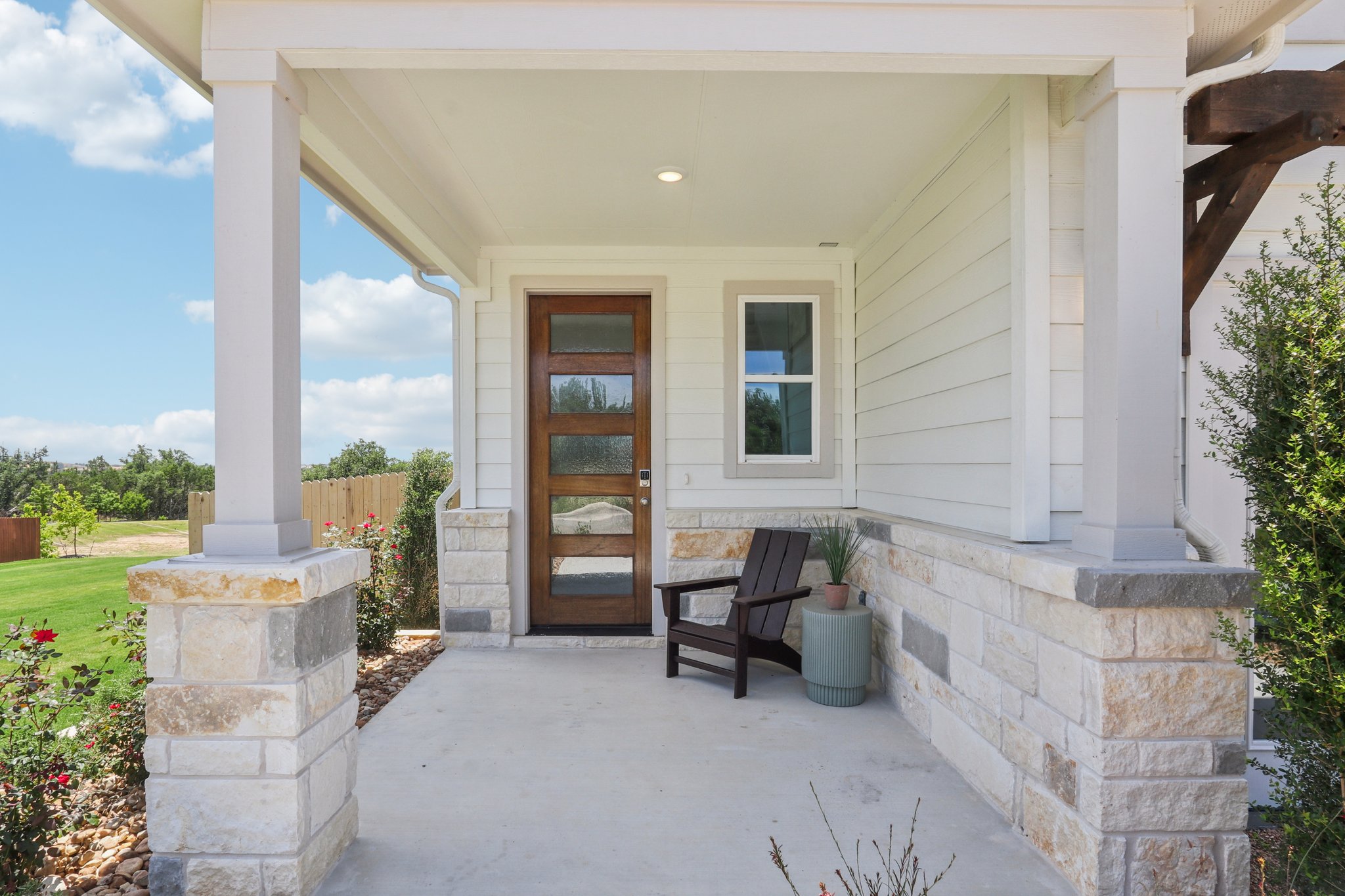 A bench in front of a house.