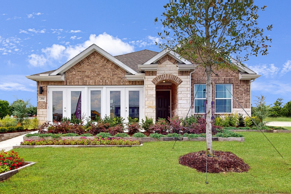 A house with a large front yard.