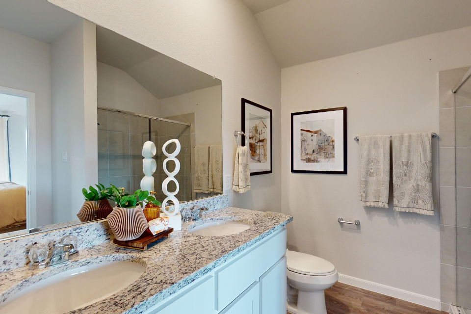 A bathroom with a marble countertop.