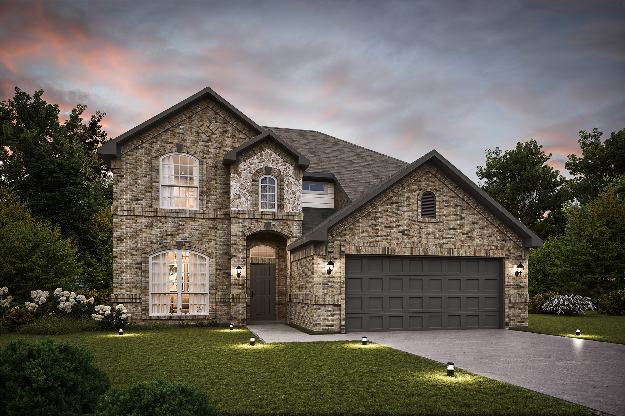 A stone house with a driveway.