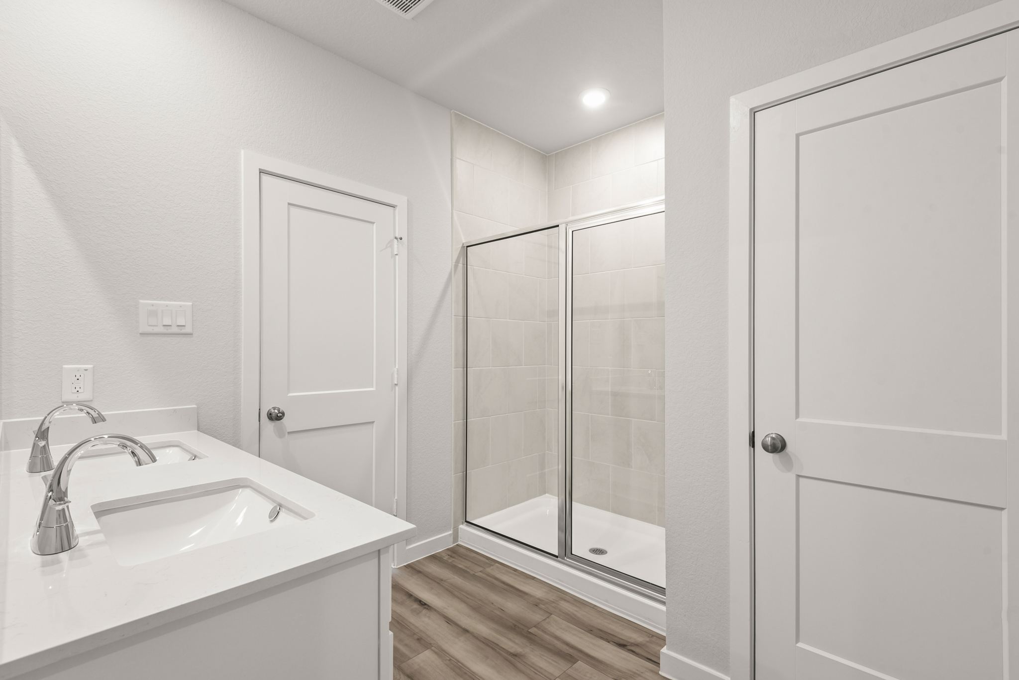 A bathroom with a glass shower.