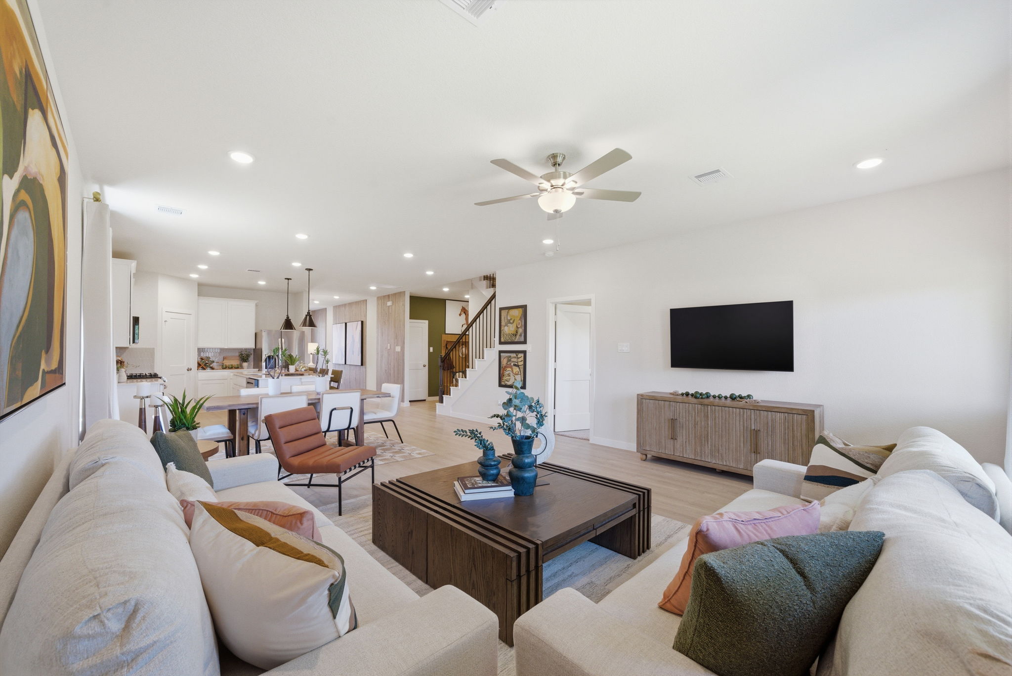 A living room with a tv and couches.