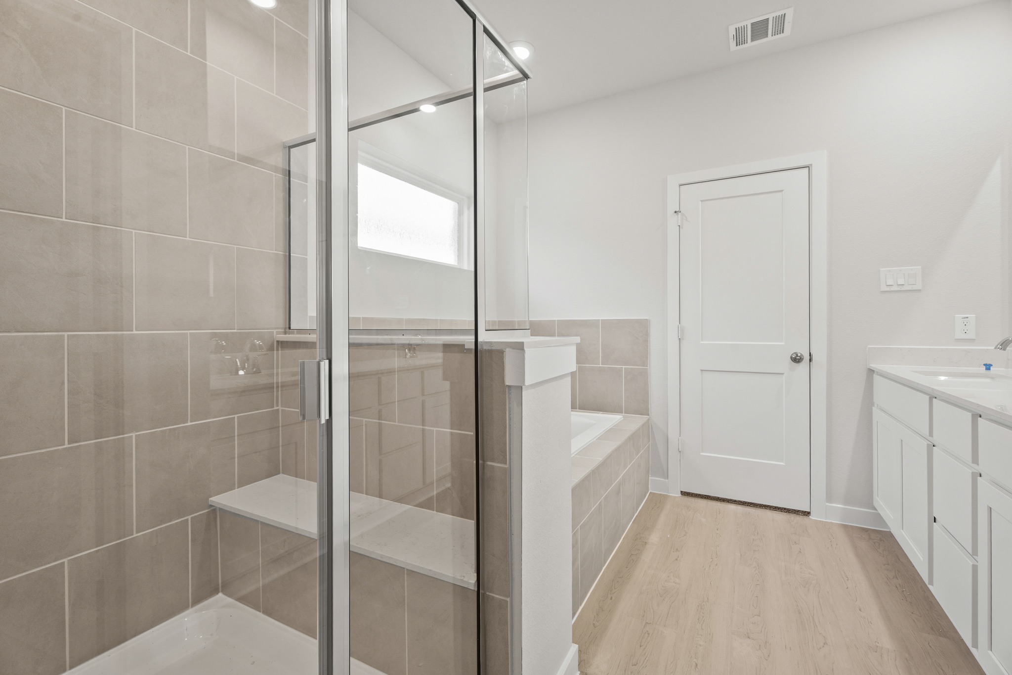A bathroom with a glass shower.