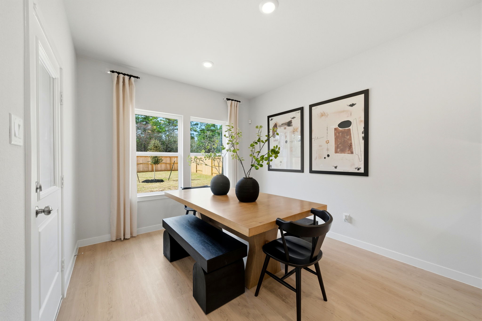 A room with a table and chairs.