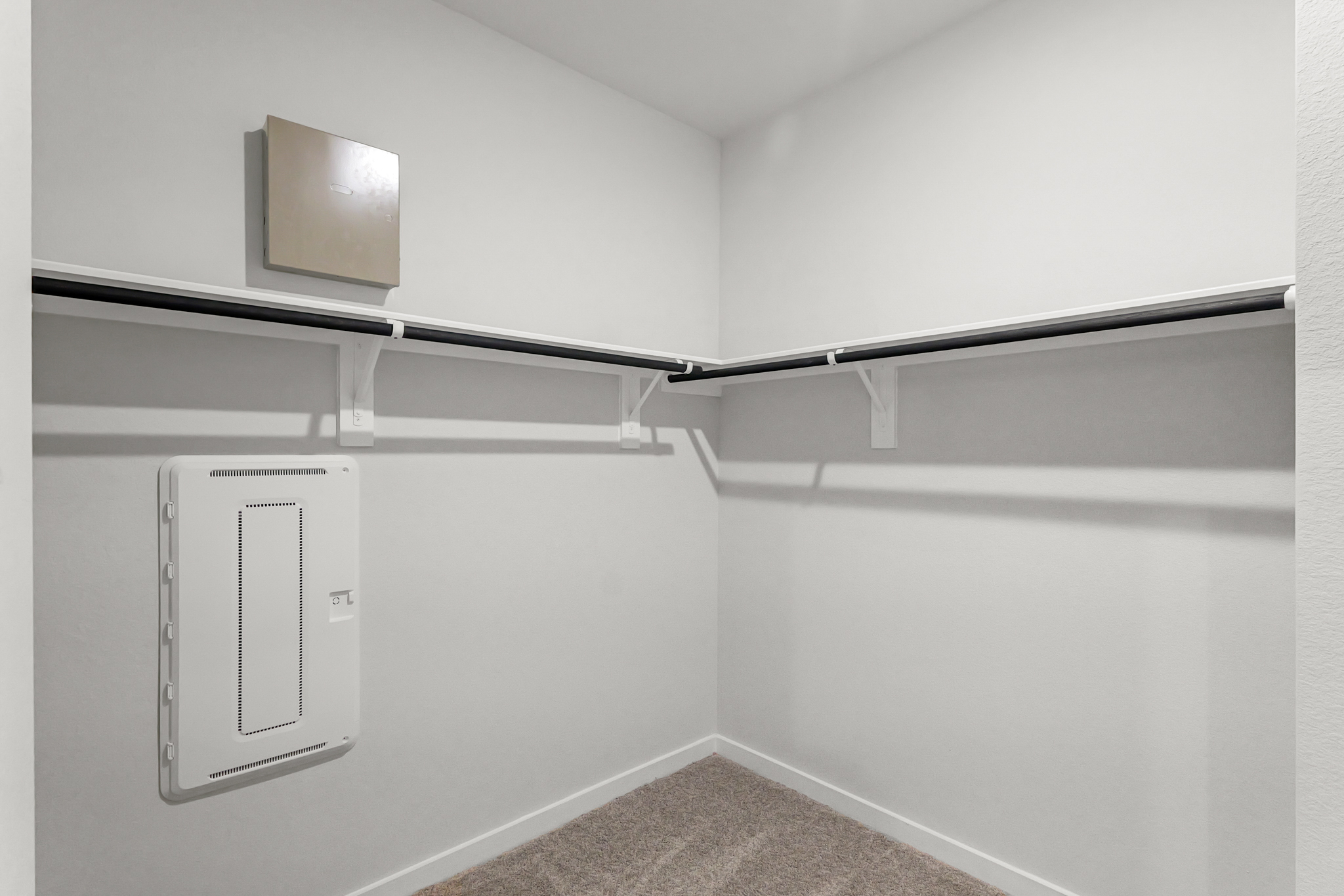 A white wall with a vent.