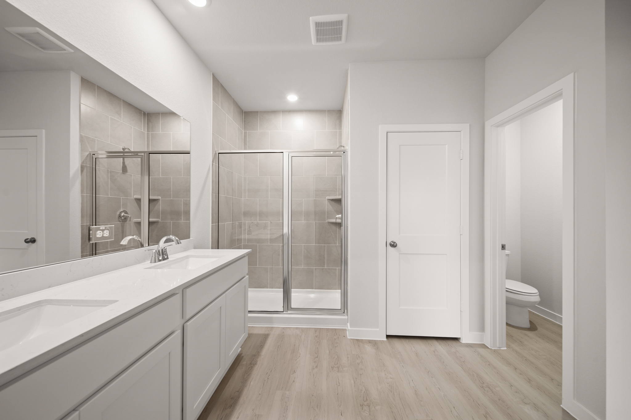 A bathroom with a glass shower.