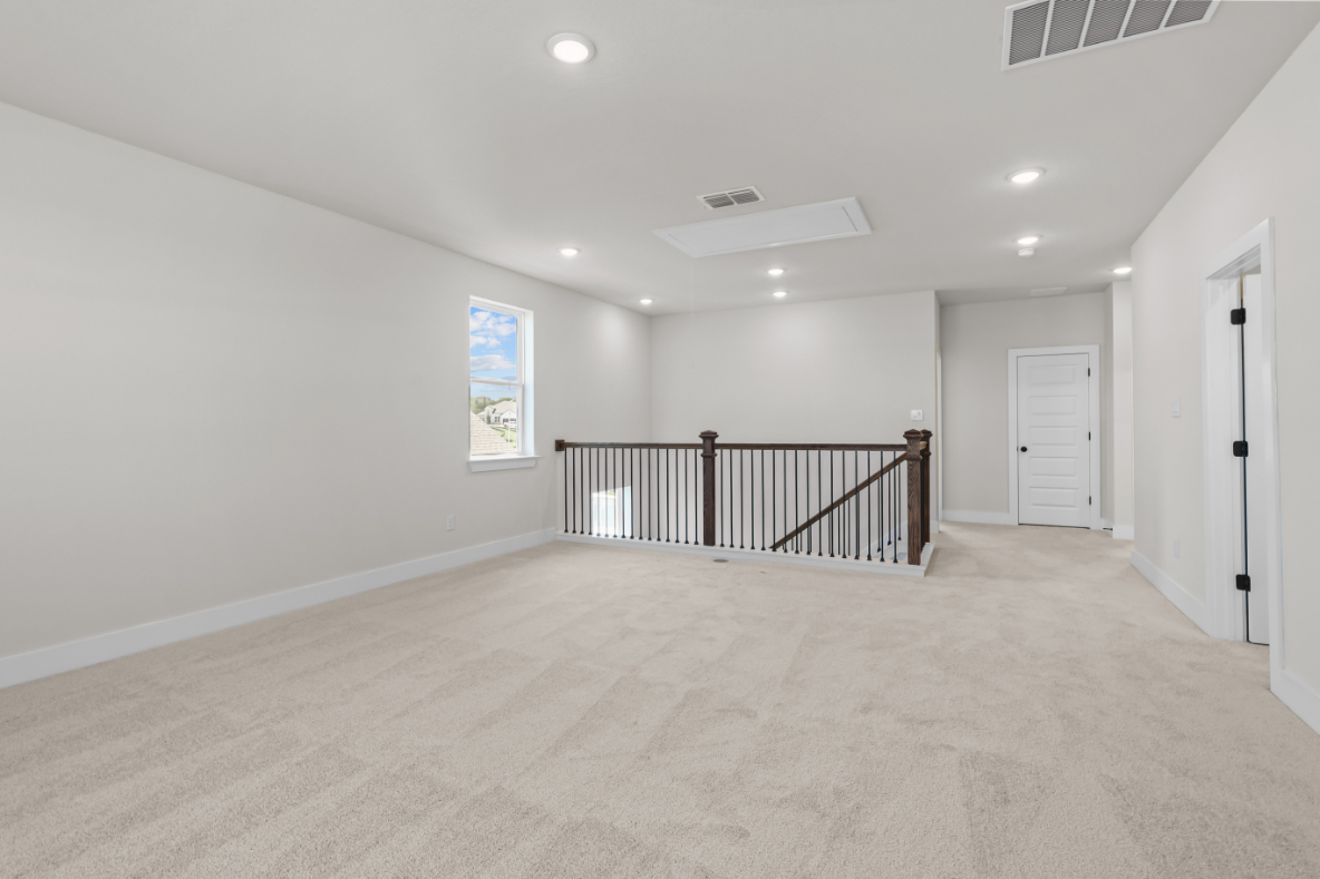 A hallway with white walls.