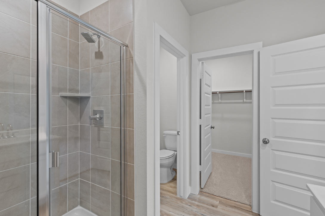 A bathroom with a glass shower.