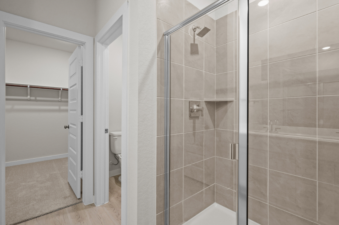 A bathroom with a glass shower.