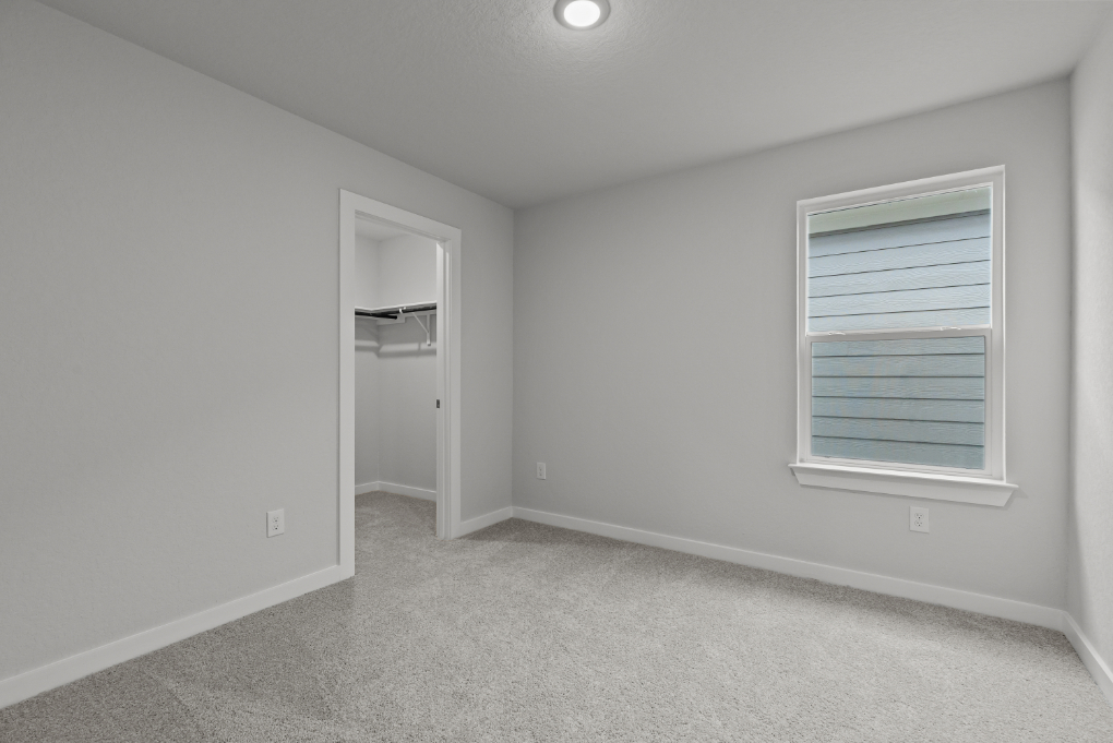 A room with a door and a window.