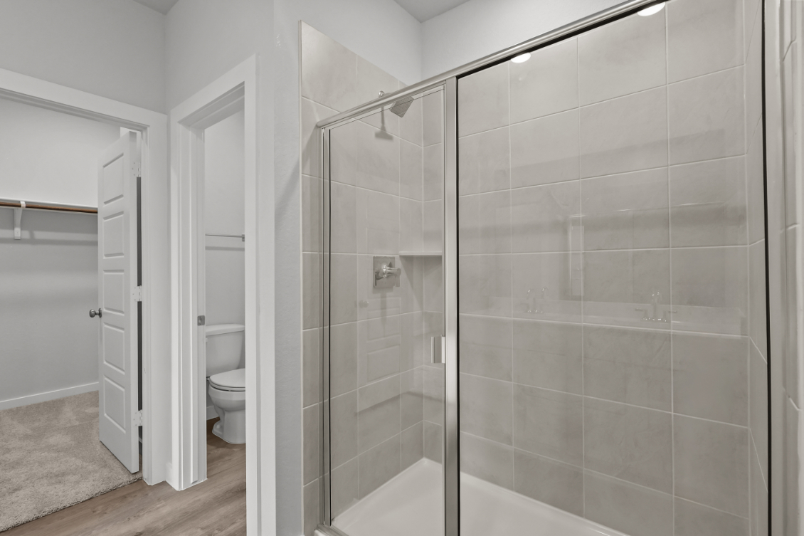 A bathroom with a glass shower.